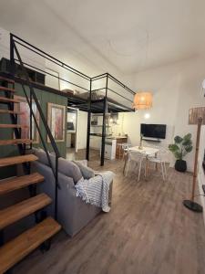 a living room with a couch and a dining room at Apart Hotel CABA in Buenos Aires