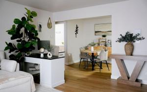 a living room with a table and a dining room at Modern 1BR w/ Workspace near O'Hare in Chicago +33 photos