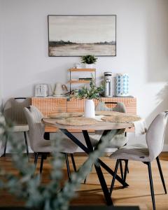 a dining room with a table and chairs at Modern 1BR w/ Workspace near O'Hare in Chicago