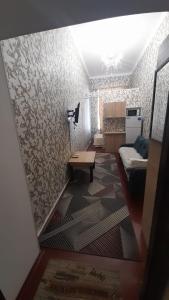 a small living room with a couch and a table at Апартаменти в Центі Одеси in Odesa