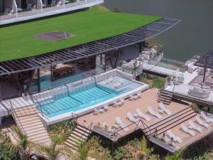 an aerial view of a house with a swimming pool at Roka Hotel in Guatapé