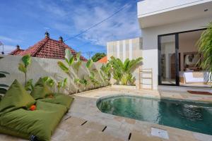 a swimming pool in the backyard of a villa at Asaka Private Villa in Nusa Penida