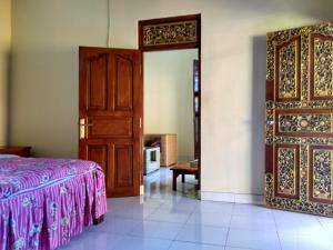 Postel nebo postele na pokoji v ubytování Rusma House Ubud