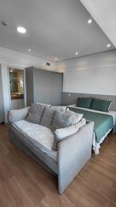 a living room with a couch and a couch at Tropical Executive Suite Flat 1001 Veiw in Manaus +29 photos