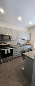 a kitchen with a stove and a counter top at Jitè's Hub in Saskatoon