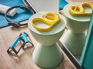 a pair of yellow scissors sitting on top of shelves at ibis budget Issoire in Issoire