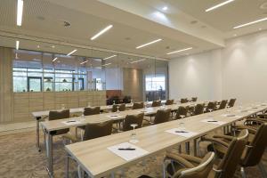 a large room with rows of tables and chairs at elaya hotel kleve, Trademark Collection by Wyndham in Kleve