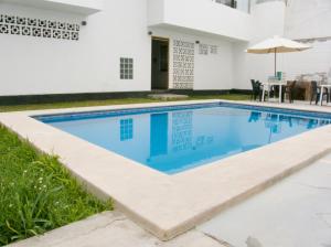 a swimming pool in the backyard of a house at Apartment with Beach Exit 204 in Punta Negra +21 photos