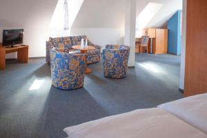 Postel nebo postele na pokoji v ubytování Hotel am Markt