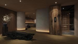 a wine tasting room with a table and wine racks at Gensen Itto Minamiizu in Minamiizu