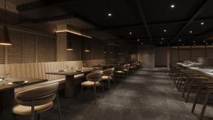 a dining room with long tables and chairs at Gensen Itto Minamiizu in Minamiizu