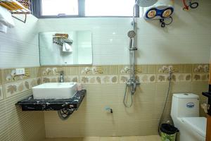 a small bathroom with a sink and a shower at Bong's House Sapa in Sapa +19 photos