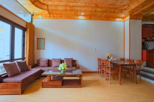 a living room with a couch and a table at Bong's House Sapa in Sapa