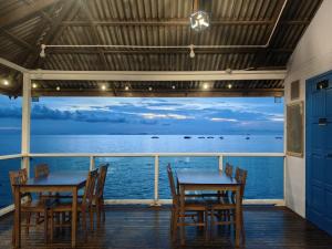 a dining room with tables and chairs on a boat at X Rector Finest in Tioman Island