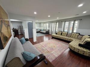 a living room with two couches and a rug at Anchor Motel in Seaside Heights