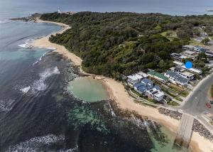 an aerial view of a beach with houses and the ocean at Norah Beach Shack 2 in Norah +3 photos