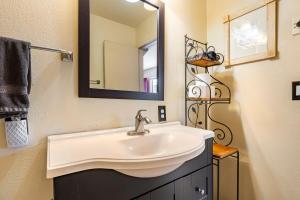 a bathroom with a sink and a mirror at Old Town Cottonwood Cottage in Cottonwood +36 photos