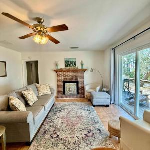 a living room with a couch and a fireplace at Bayfront- 2mins from Boat Launch in Eastpoint