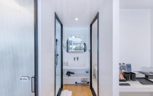 a bathroom with a sink and a mirror at Air Space Camp Khao Yai in Pak Chong +53 photos