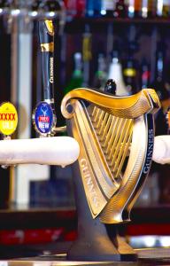 a gold chair sitting on a table in a bar at Jack Duggans Pub in Bathurst