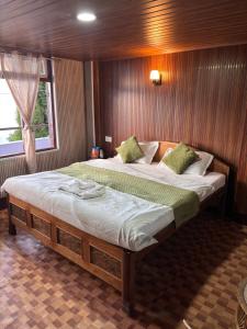 a bedroom with two beds on a boat at P Square Resto Cafe n Stay in Darjeeling