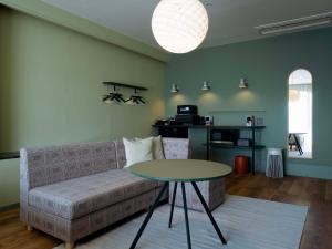 a living room with a couch and a table at Hotel Espacio 山口 -ADULT ONLY- in Yamaguchi +35 photos