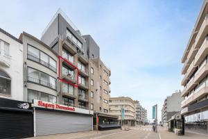 a street with tall buildings on a city street at Walter Vilain 0301 G in Sint-Idesbald