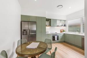 a kitchen with a table and chairs in a kitchen at Thirty Eight in North Haven