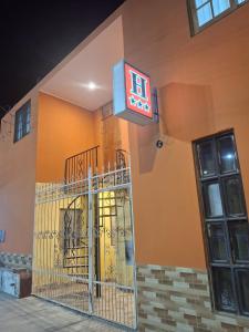 a sign on the side of a building at Hospedaje AMAPI - San José in El Carmen +10 photos