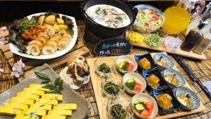 a table topped with lots of different types of food at Kochi Pacific Hotel in Kochi