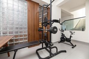 a fitness room with a gym in a house at 熹楠丽江古城 in Lijiang
