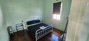 a bedroom with a bed in the corner of a room at Gloucester View in Gloucester