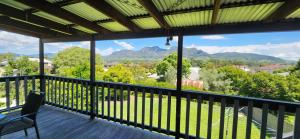 a balcony with a view of the mountains at Gloucester View in Gloucester