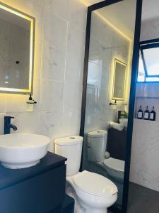 a bathroom with a toilet and a sink at Casa Mancera Oaxaca in Yelateni +11 photos