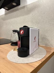 a coffee maker sitting on top of a counter at Apartment Delux in Posušje