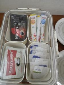 a lunch box with toothbrushes and other items in it at K77 Backpackers - Jungle Tours in Medan