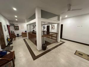 a living room with a large cross on the wall at Vagamon Hill Chimes in Vagamon