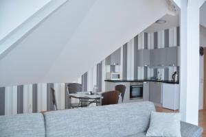 a living room with a couch and a table at Apartmá Kateřina Velké Losiny in Velké Losiny