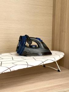 a phone is sitting on top of a bed at Avra Yard Suites in Pefkochori