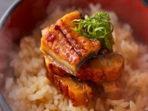a bowl of rice with meat and greens on top at Wan Wan Paradise Hamanako in Hamamatsu +38 photos