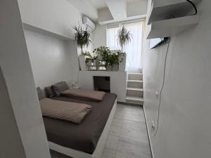 a small room with a bed and a fireplace at INDUSTRIAL STUDIO 1 in Ljubljana