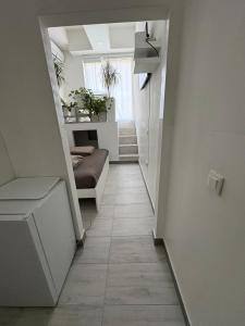 a hallway with a couch in a room at INDUSTRIAL STUDIO 1 in Ljubljana
