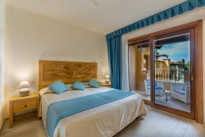 Кровать или кровати в номере Hotel Marana