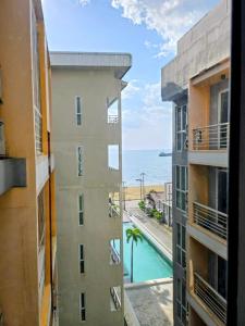 a view of the ocean from a building at Beautiful Sandy Jomtien Beach Pattaya at NeO Seaview Condo in Jomtien Beach