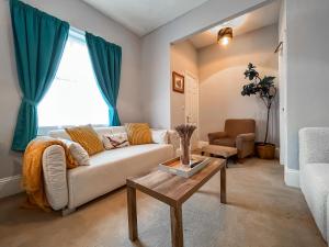 a living room with a couch and a table at The Badger Sett in Hinderwell