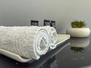 a white towel sitting on a counter top at Apartament Novi in Mrągowo +38 photos
