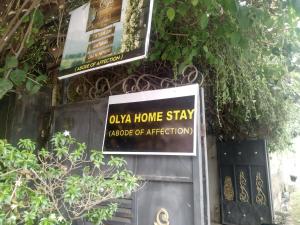 a sign that says oka home stayazaote of attraction at ADOBE AFFECTIOn in Tangalle