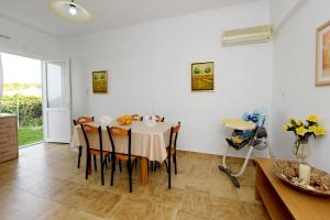 a kitchen and dining room with a table and chairs at Emerald Private Villa in Kalavarda Rhodes in Kalavárda