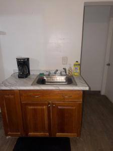 a kitchen with a sink and a counter top at Downtown Taylor Room 5 in Phoenix +2 photos