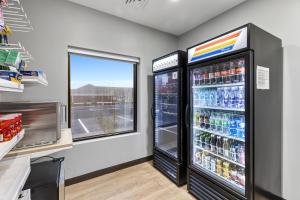 a soda refrigerator in a kitchen with a window at Spark by Hilton Abingdon I-81 near Fairgrounds in Abingdon
